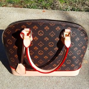 Brown tan and red accent bag